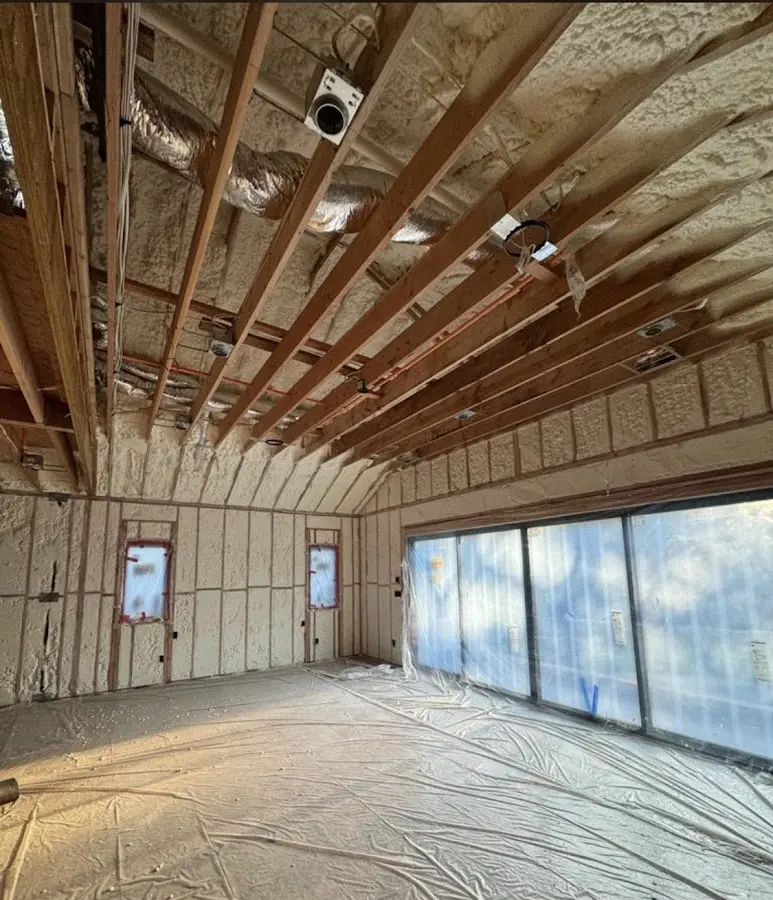 Interior walls and ceiling insulated with spray foam during new construction in Telford